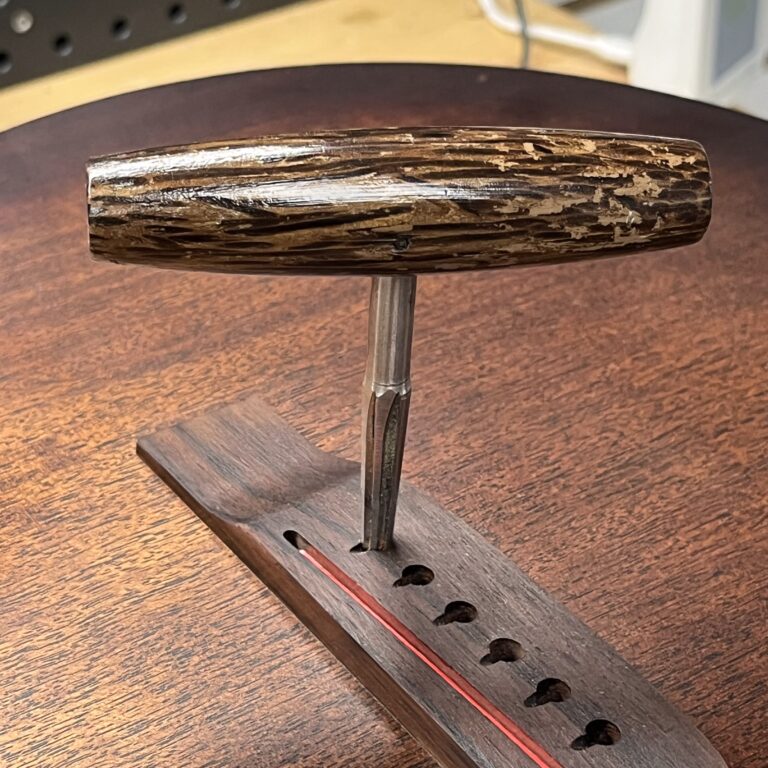 Using A Reamer To Enlarge The Bridge Pin Holes